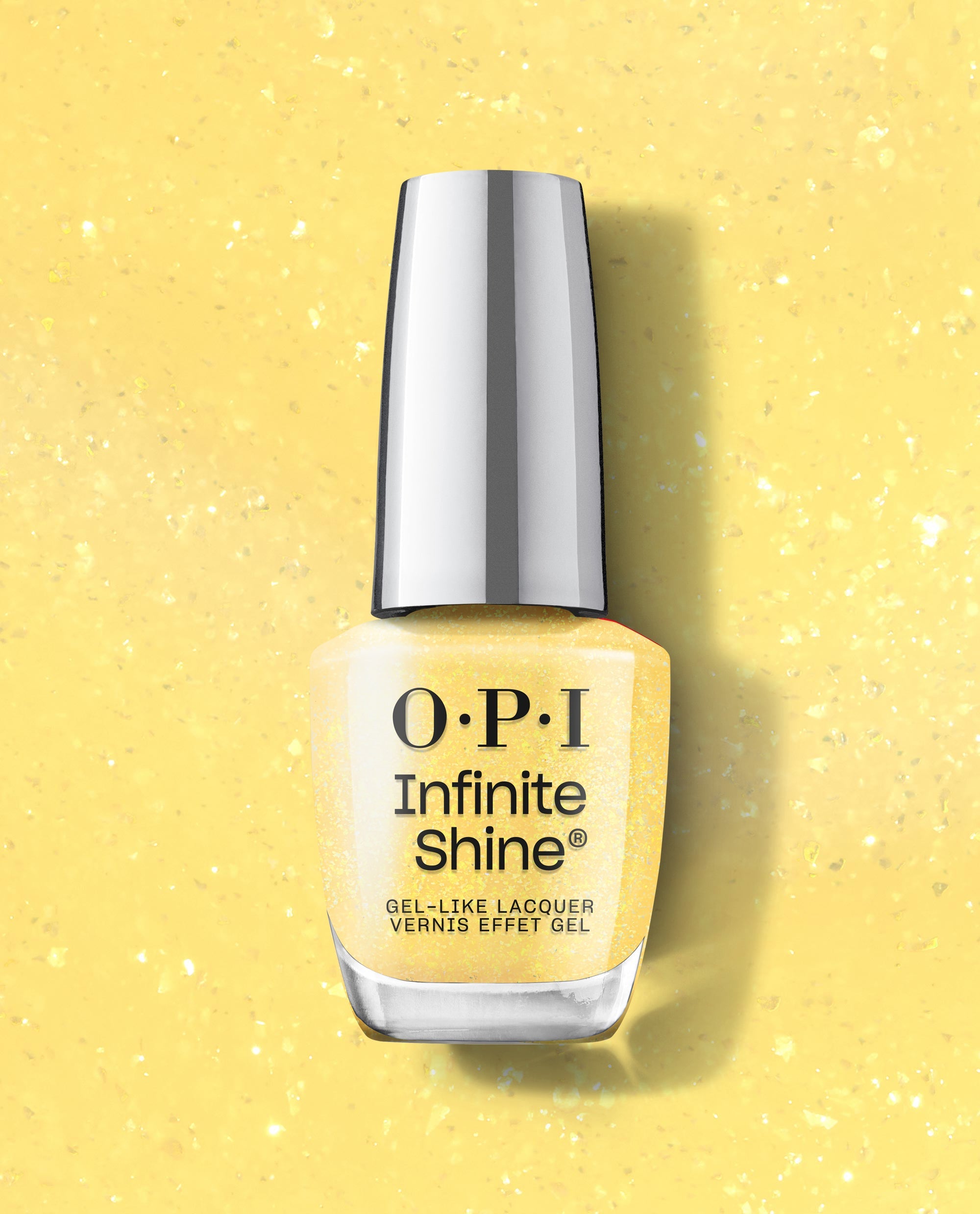 OPI Infinite Shine Slay Hello to Yellow gel-like lacquer bottle stands upright on a sparkling pale yellow background, showing shimmery yellow polish and a reflective silver cap.
