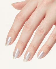 Hand with long oval nails showcases OPI Nails the Runway nail lacquer, a shimmering silver OPI nail polish with soft gradient tips, against a clean white background for a chic runway-ready manicure look.