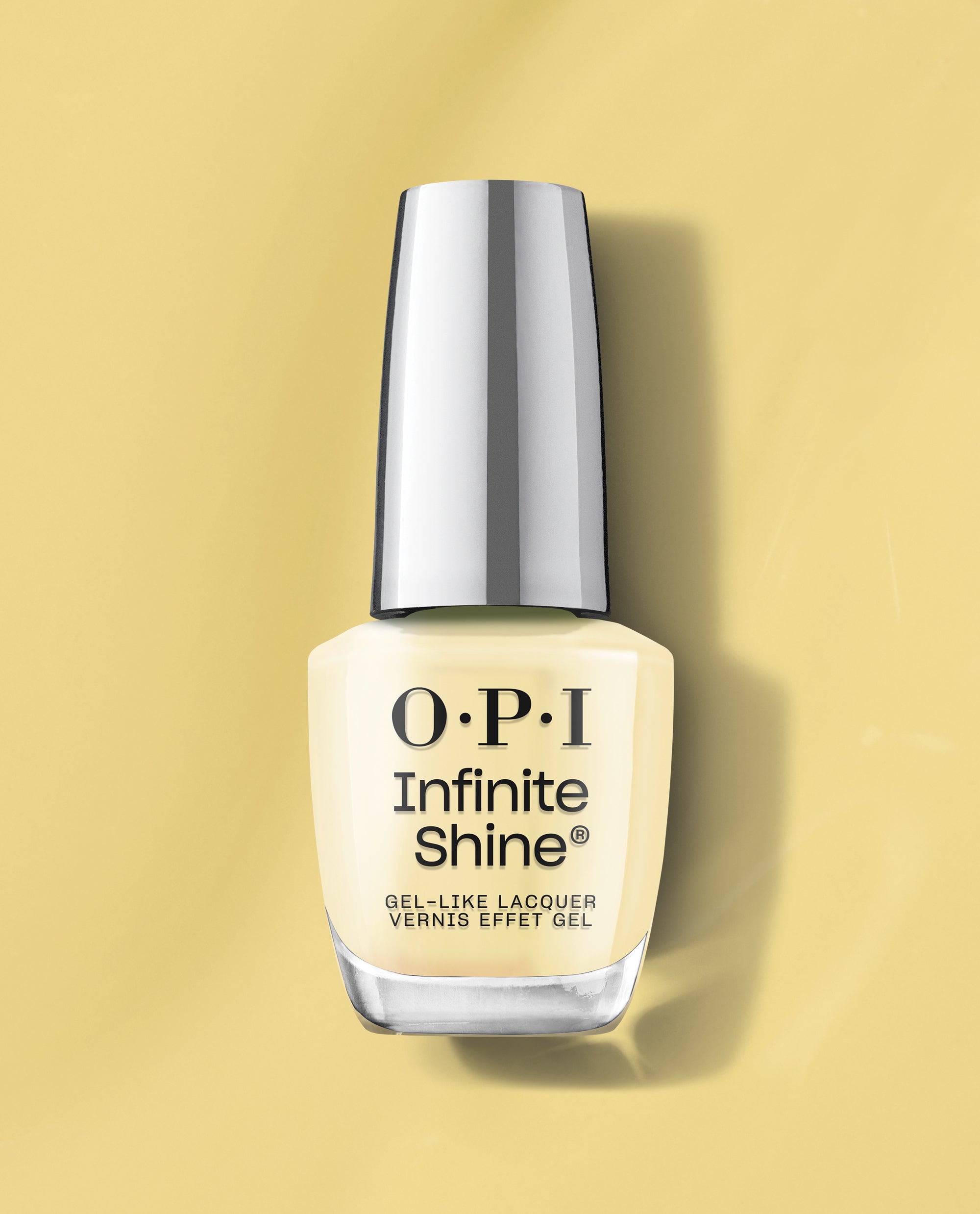 OPI Infinite Shine This Chic is Bananas yellow gel-like nail lacquer bottle standing on a matching soft yellow background with a reflective silver cap.