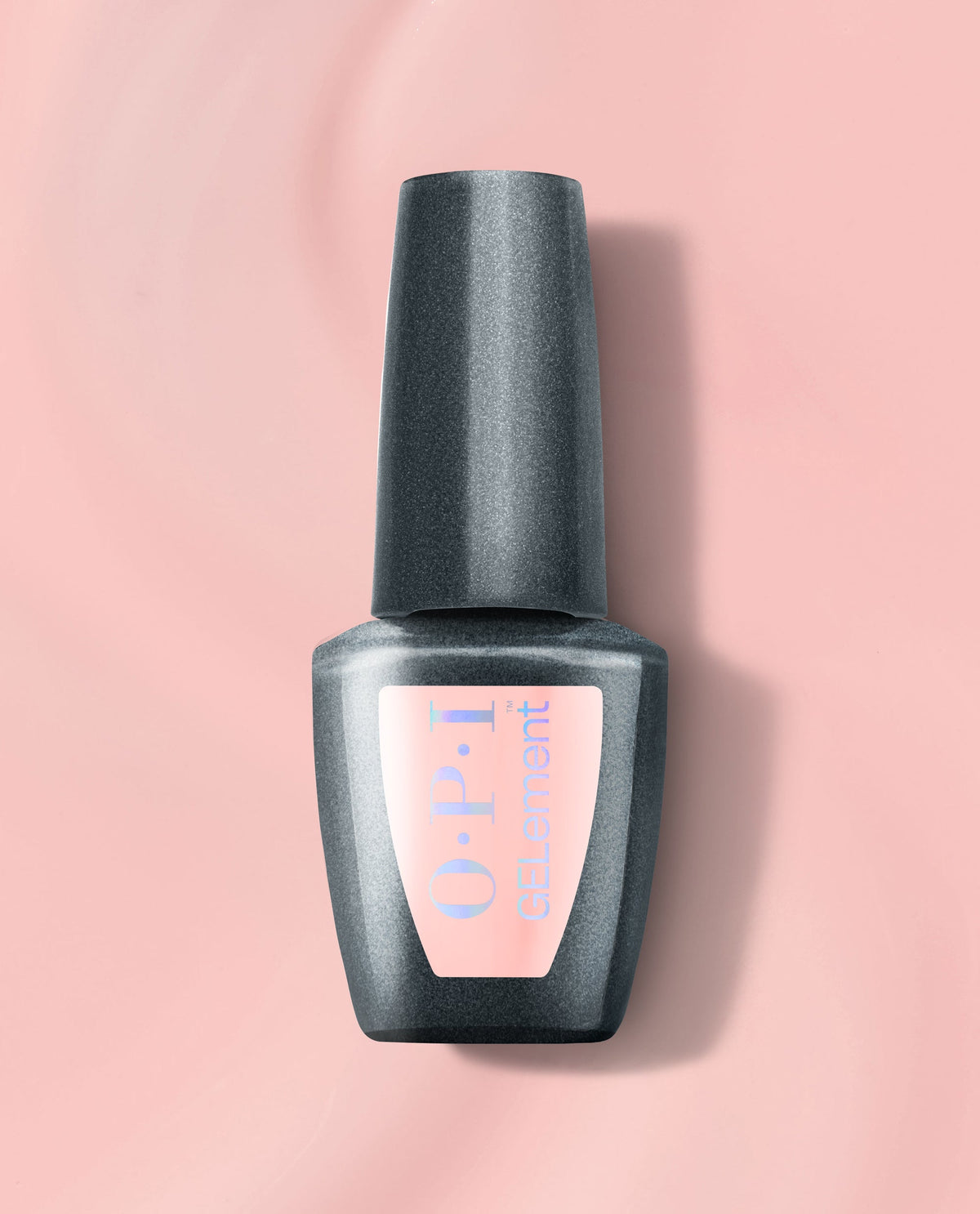 OPI Made Ya Blush at-home gel nail polish bottle with a dark gray cap and soft pink label, centered on a blush pink background for a trending manicure shade.
