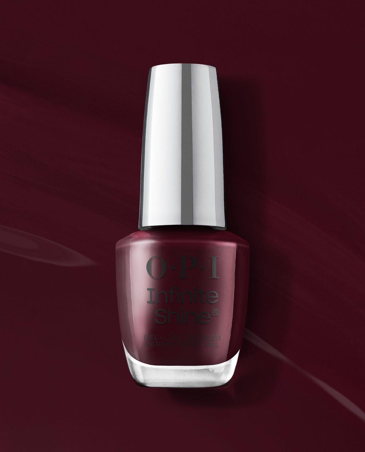 OPI Infinite Shine Mrs. O'Leary's BBQ deep burgundy gel-like lacquer bottle stands against a matching glossy wine-red background, showcasing a rich shade for fall nail colors.